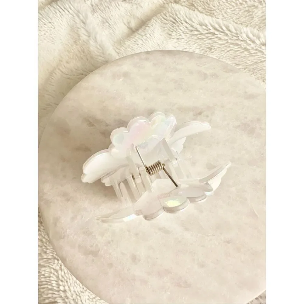 Iridescent white hibiscus flower hair claw